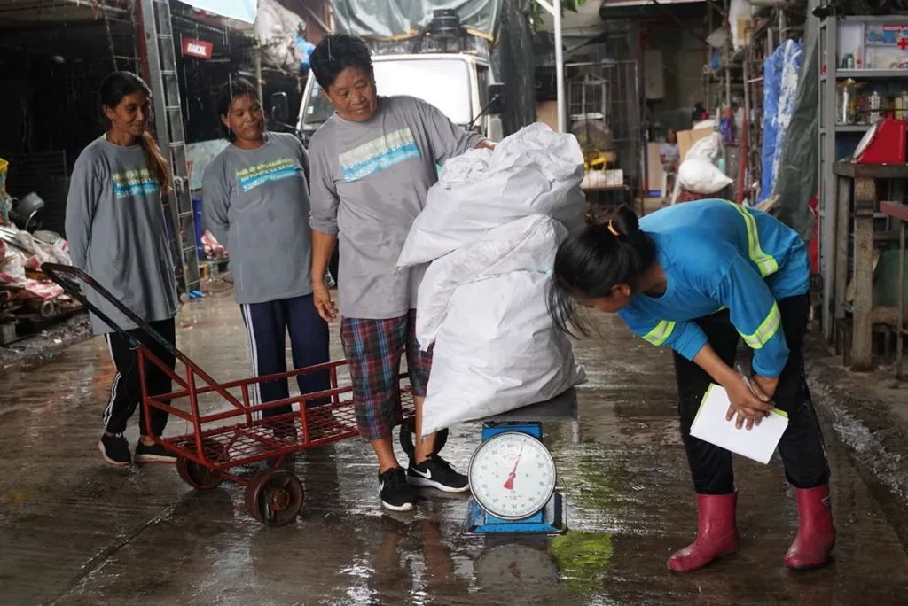 Collected plastic becomes a source of income and opportunity—Plastic Bank members bring their daily haul to branches and exchange for money and essential benefits.