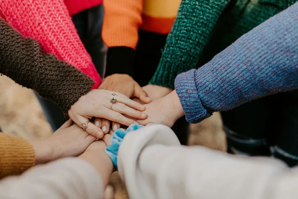 A group of hands stacked together.