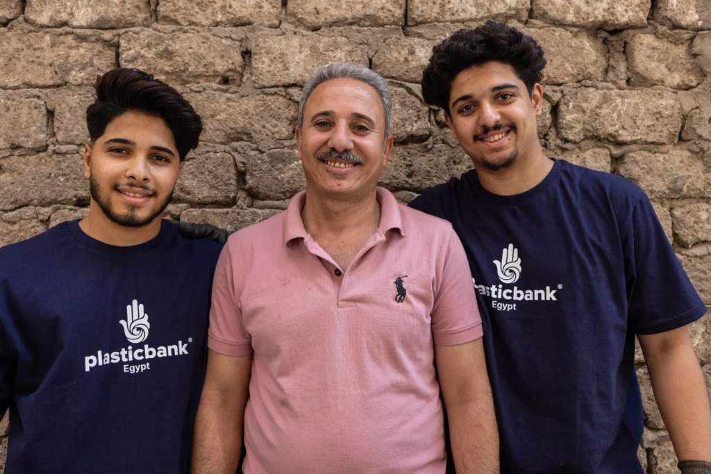 Men standing at the plastic collection branch